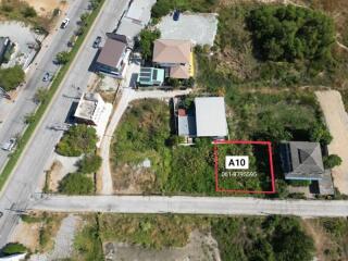 Aerial view of property A10 with boundary marked near roadway and adjacent buildings