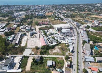 Aerial view of a suburban area showing residential and commercial structures