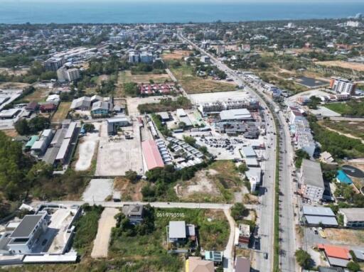 Aerial view of a suburban area showing residential and commercial structures