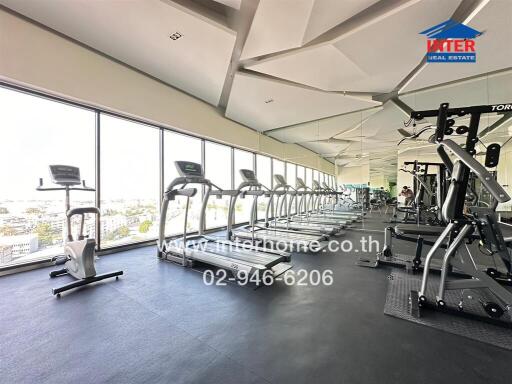 Modern gym with panoramic city views from high floor