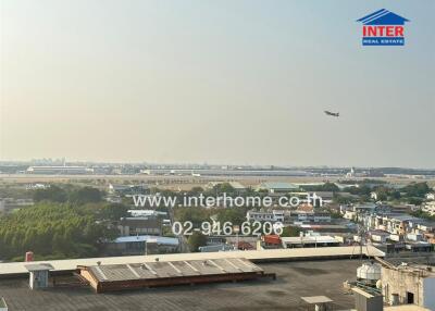 Panoramic view of cityscape with airplane in the sky