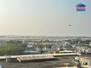 Panoramic view of cityscape with airplane in the sky