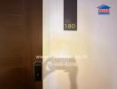 Modern apartment entrance with digital lock and door number