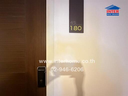 Modern apartment entrance with digital lock and door number