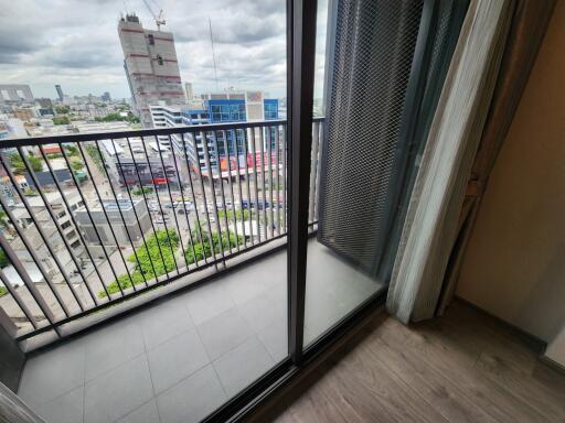 Spacious balcony with city view and sliding glass doors