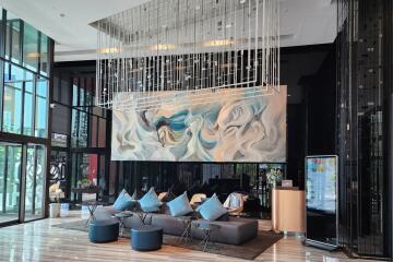 Luxurious hotel lobby with modern artistic decor and elegant seating area