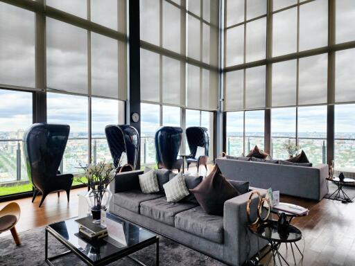 Luxurious high-rise apartment living room with panoramic city views