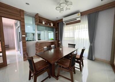 Stylish dining room with wooden furniture and modern design