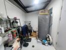 Cluttered home garage space with storage and laundry area
