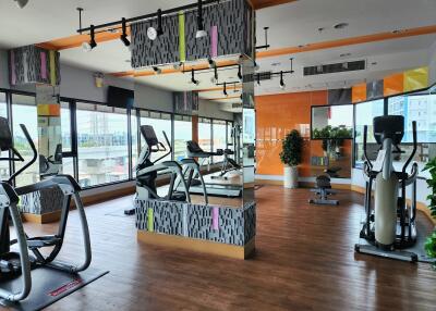 Modern gym with various exercise equipment in a residential building