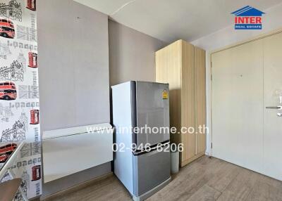 Compact bedroom with refrigerator and wardrobe