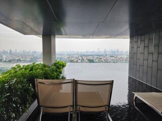 Covered balcony overlooking the city and river