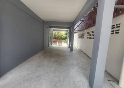 Spacious garage with high ceiling and natural light