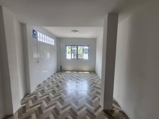 Spacious and bright living room with patterned tile flooring