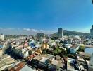 Panoramic city view from a high-rise building balcony