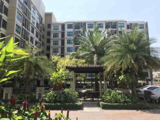 Lush tropical landscaping in front of a modern residential building