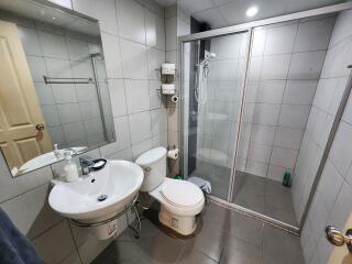 Spacious modern bathroom with shower enclosure and mirror