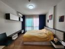 Spacious bedroom with modern decor and ample natural light