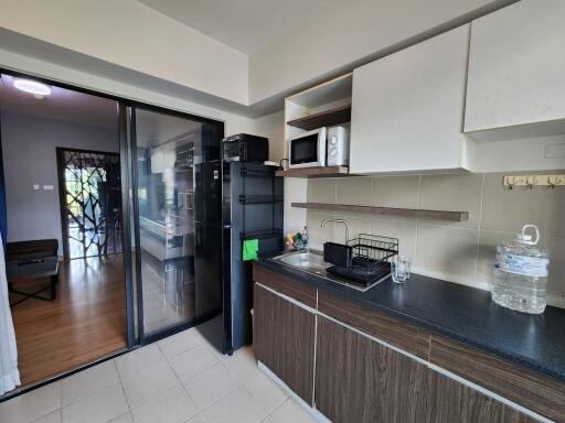 Spacious kitchen with modern appliances and direct access to the backyard