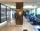 Modern gym interior with exercise equipment and mirrored walls