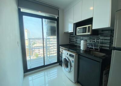 Modern kitchen with high-end appliances and city view