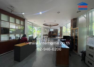 Spacious office interior with reception desk and seating area