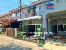 Exterior view of townhouses in a sunny residential area