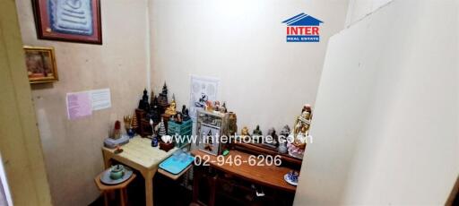 Small room with religious or spiritual altar and decorations
