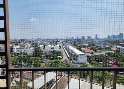 Panoramic city view from high-rise balcony