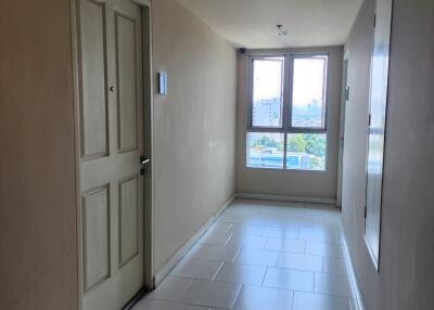 Bright hallway with tiled floor and large window