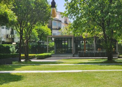 Lush green outdoor relaxation area in a residential complex