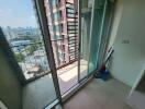 Spacious balcony with city view and sliding glass doors