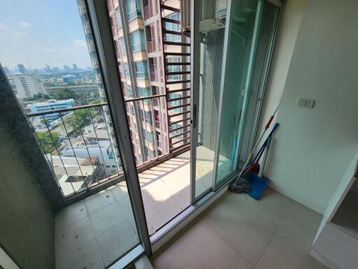 Spacious balcony with city view and sliding glass doors