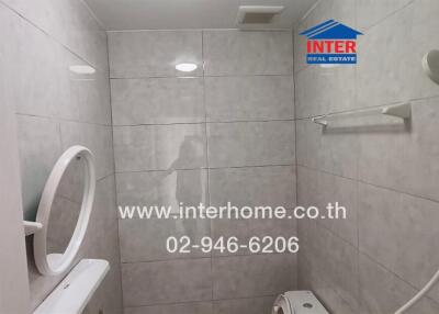 Modern bathroom interior with tiled walls