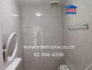 Modern bathroom interior with tiled walls