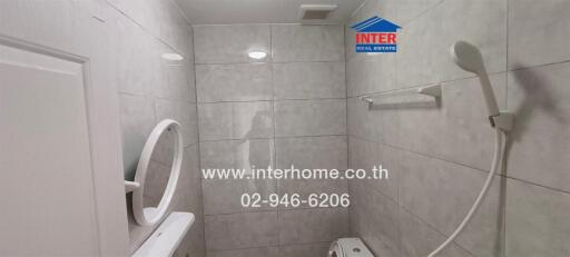 Modern bathroom interior with tiled walls