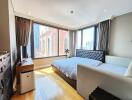 Bright and spacious bedroom with large windows and city view