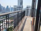 High-rise apartment balcony with city skyline view