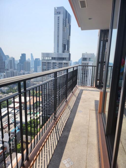 High-rise apartment balcony with city skyline view