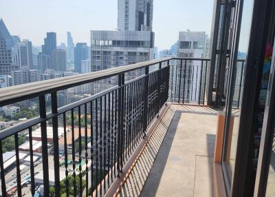 High-rise apartment balcony with city skyline view