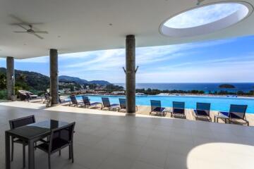 Spacious patio area with swimming pool and ocean view