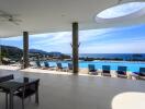 Spacious patio area with swimming pool and ocean view