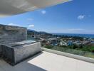 Spacious balcony with panoramic sea view and built-in bench