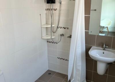 Modern bathroom with walk-in shower and elegant tiling