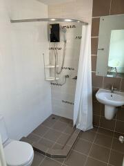 Modern bathroom with walk-in shower and elegant tiling