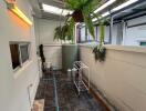 Spacious covered patio with hanging plants and stylish flooring
