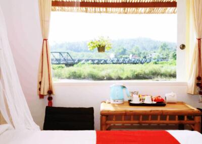 Cozy bedroom with nature view and tea setup