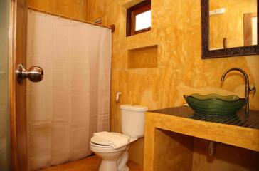 Elegant bathroom with golden walls and designer sink