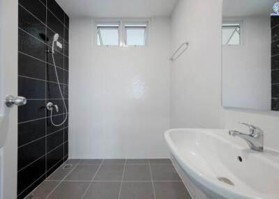 Modern bathroom with white and black tile design