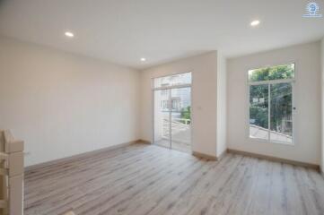 Spacious and bright modern living room with large windows